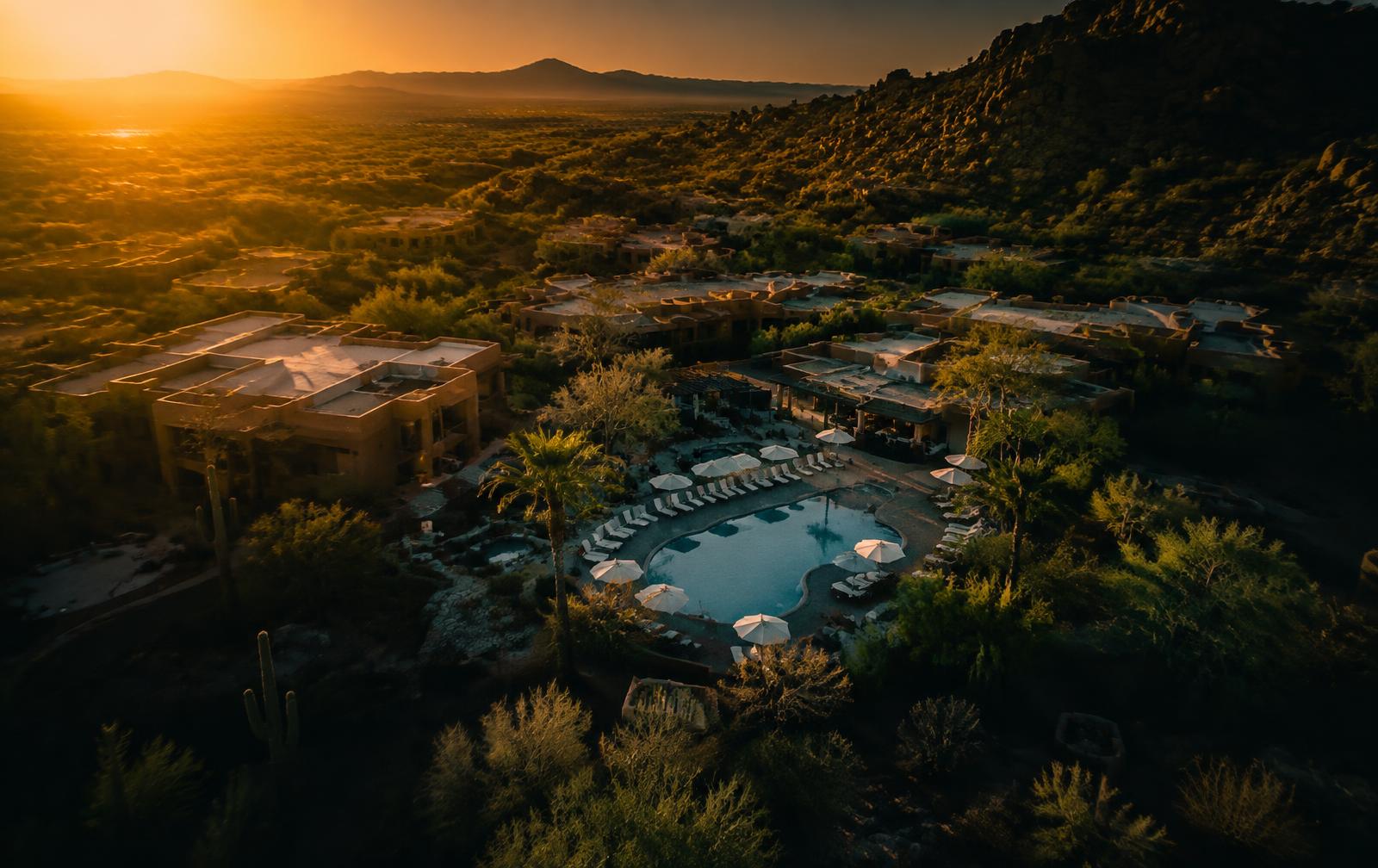 Aerial view of a desert resort at golden hour